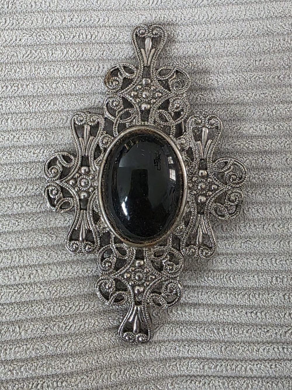 Silver Filigree Cross Pendant with Black Cabochon